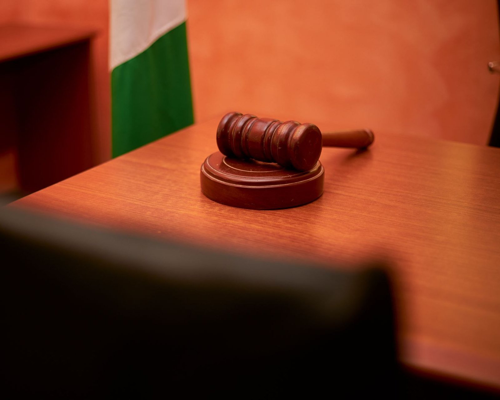 A gavel on a courtroom desk, representing the proceedings in the High Court in Accra